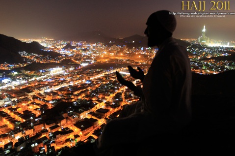 A Muslim pilgrim prays as visits the Hiraa cave at the top of Noor Mountain on the outskirts of Mecca, Saudi Arabia on November 2, 2011.
